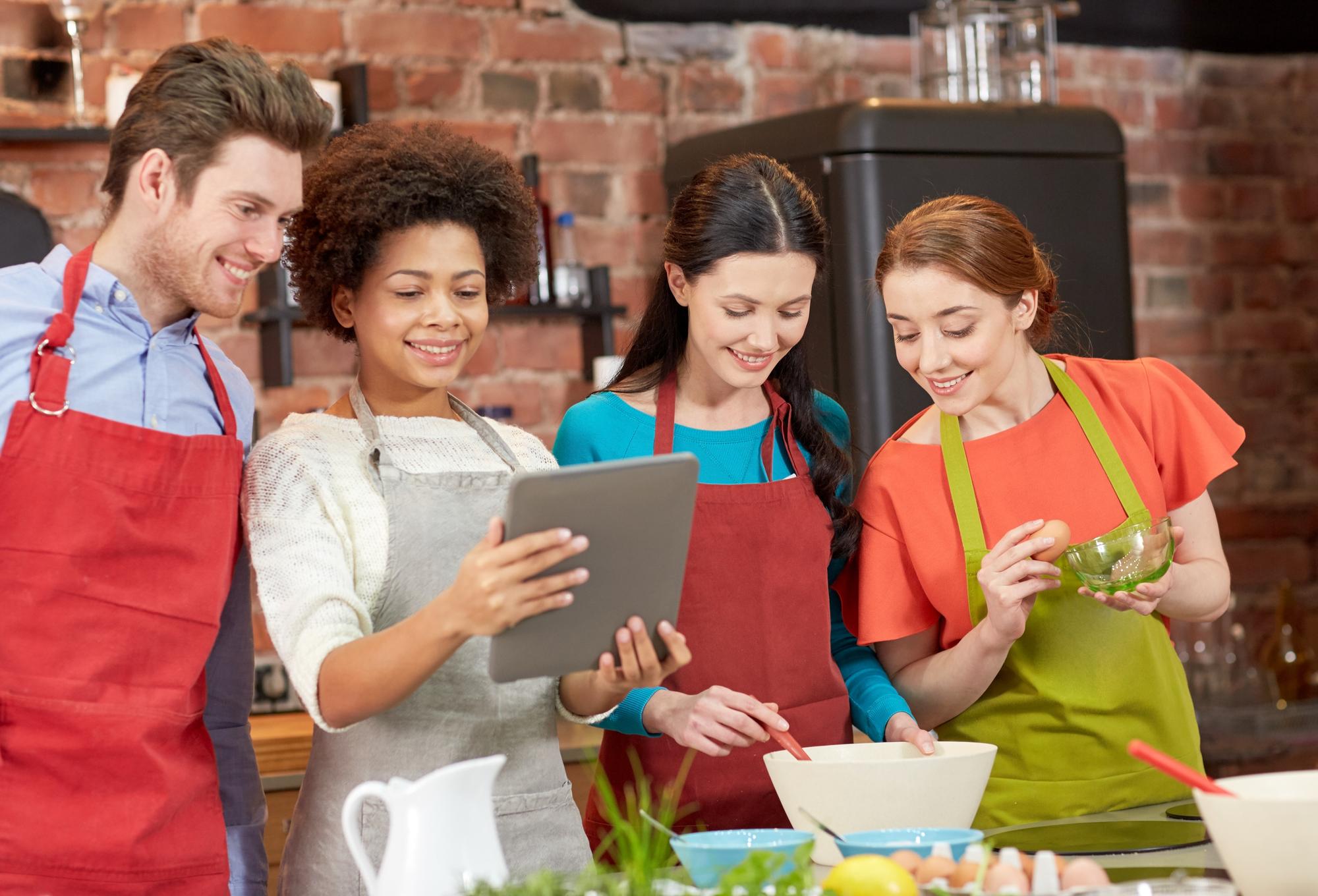 Large hands-on class with students around a central island